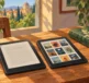 Due eReader affiancati su un tavolo accanto a un libro cartaceo